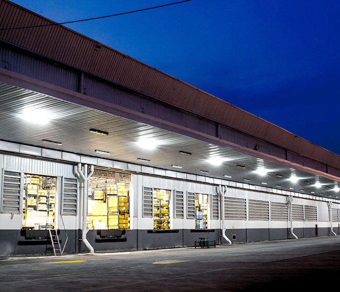 A warehouse with lights on.