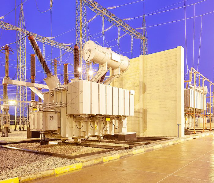 A large electrical equipment outside of a building.